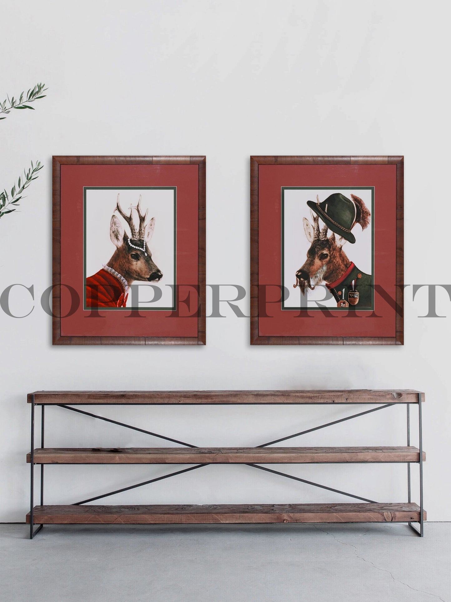 Kunstdrucke mit Rehen gerahmt im Raum